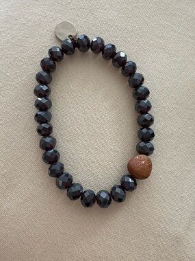 Faceted Dark Blue Beaded Stretch Bracelet with Goldstone Accent